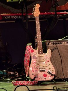 a guitar and amp are sitting on the floor