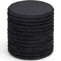 a stack of black stone coasters on a white background