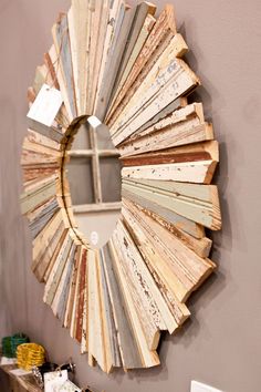 a mirror that is made out of wooden planks