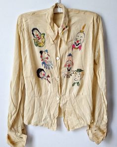 an old jacket with cartoon characters on it