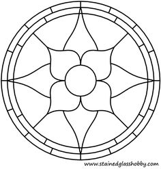 a circular stained glass window with four petals in the center and one flower at the bottom