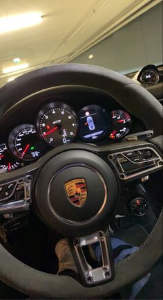 the interior of a porsche car with gauges and dash lights on it's dashboard