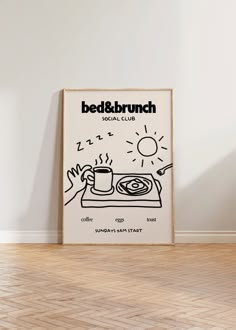 a poster with the words bed & brunch on it next to a wooden floor