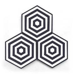 three black and white hexagons on a white background