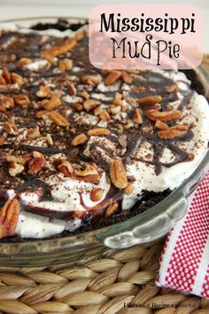 a close up of a pie on a table with the words mississpii mud pie above it