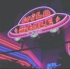 a neon sign that says wild steele on it