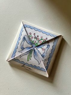 an origami piece with flowers on it