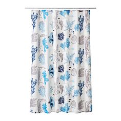 a shower curtain with blue and white flowers on the outside, in front of a white background