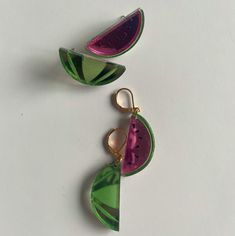 Slice into summer with these watermelon statement earrings! Studs or 14k gold filled huggie – choose your own adventure. Lookin' gorg at 2" – one earring represents a succulent slice, the other the melon's gorgeous exterior. Every piece of jewelry is hand formed and hand assembled by me. Due the unique nature of the product you may not get the pictured earrings. Unique Handmade Summer Hoop Earrings, Unique Handmade Hoop Earrings For Summer, Green Teardrop Jewelry For Summer, Green Summer Earrings For Everyday Wear, Green Everyday Earrings For Summer, Fun Green Drop Earrings, Adjustable Watermelon Colored Jewelry For Gifts, Green Fun Drop Earrings, Adjustable Watermelon Colored Jewelry Gift