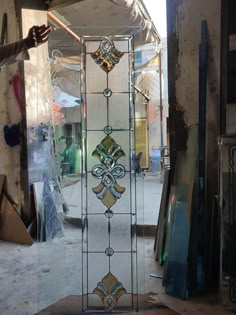 an old stained glass door in the process of being restored and remodeled