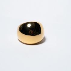 a close up of a ring on a white surface