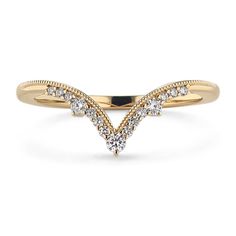 a yellow gold ring with diamonds on it