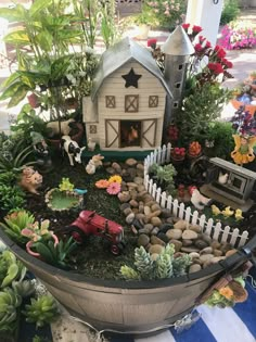 a potted planter filled with lots of different types of plants and animals in it