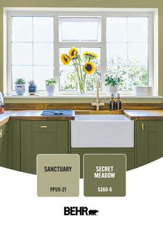 a kitchen with sunflowers on the window sill and an advertisement for behr