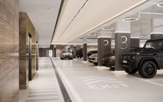 an empty parking garage with several cars parked in the space next to eachother