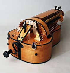 a wooden musical instrument sitting on top of a table