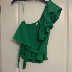 Details: Gorgeous Green One Shoulder Blouse With Ruffle Accent, Size Zipper And Attached Strap. Size + Fit: Size Medium, Fits True To Size. Condition: Nwt - Brand New, Never Worn! Fabric: 96% Polyester, 4% Spandex Care: Tag Attached And Still Intact For Further Instructions. Green Ruffled Party Top, Green One-shoulder Summer Tops, Summer One Shoulder Green Tops, Green One-shoulder Top For Summer, Summer Green One Shoulder Top, Chic Green Ruffled Blouse, Elegant Green One-shoulder Top, Green Ruffled Tops For Day Out, Chic One-shoulder Blouse With Ruffles