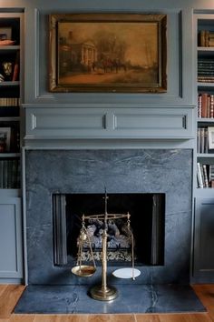 a living room with a fire place and bookshelves