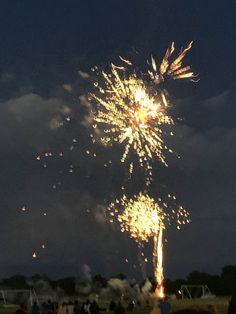 fireworks are lit up in the night sky