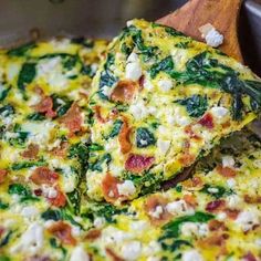 some food that is on top of a wooden cutting board in a metal pan and has been cut into pieces