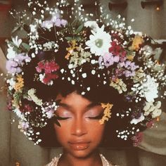 a woman with flowers in her hair