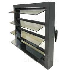 a black metal shelf with glass shelves on it