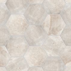 a white tile floor with hexagonal pattern