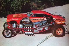 an old photo of a drag car with the engine in it's side view