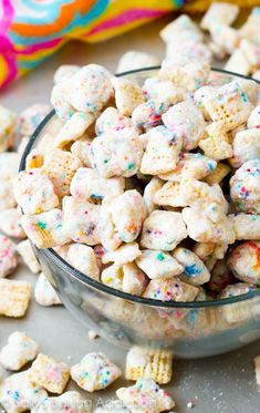 a glass bowl filled with sprinkles and cereal