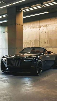 a black car parked in a parking garage