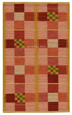 an orange and red rug with squares on it