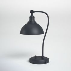 a black desk lamp on a white background