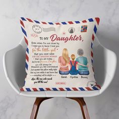 a pillow with an image of two people sitting on top of it and the words to my daughter