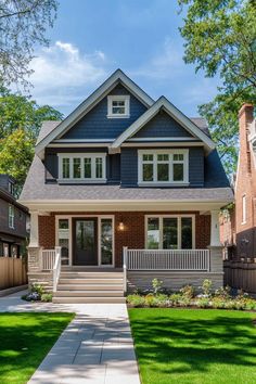 a house that is in the middle of a yard with grass and trees around it