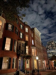 an old brick building is lit up at night