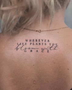 the back of a woman's neck with an inscription that reads, wherever life plants you grow with grace