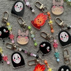 many different key chains with cartoon characters on them