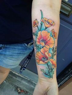 a person with a flower tattoo on their arm