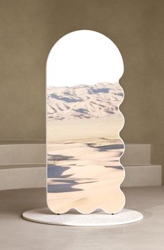 an open door with a view of the desert and mountains in the background is shown