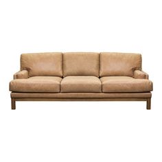 a tan leather couch with wooden legs and armrests on an isolated white background