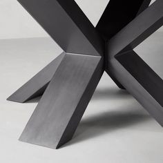 an abstract metal sculpture sitting on top of a table