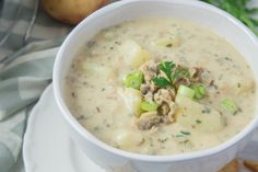 a white bowl filled with soup on top of a table