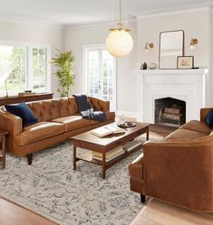 a living room filled with furniture and a fire place