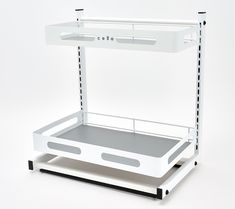 a white cart with two trays attached to the sides and one shelf on each side