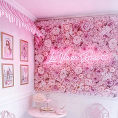 a room with pink flowers on the wall