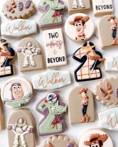 decorated cookies are arranged in the shape of numbers and characters for children's birthdays