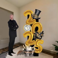 a man standing in front of a large number sign