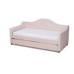 a pink daybed with a mattress underneath it