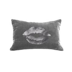 a black and white photo of a pillow with a kiss on it's lips