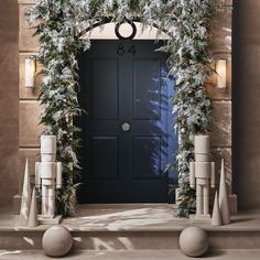 the front door is decorated with garland and lights